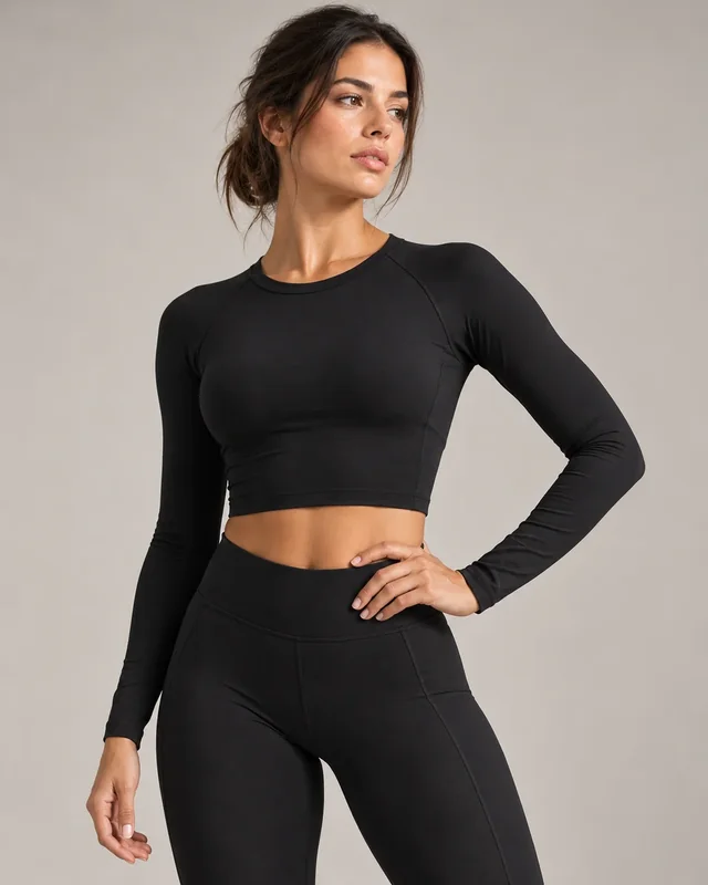 Black long-sleeved cropped activewear top.