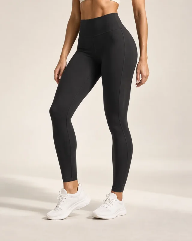 Black sculpt leggings styled with white trainers.